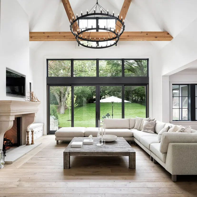 Spacious living room with a large black-framed sliding glass door 