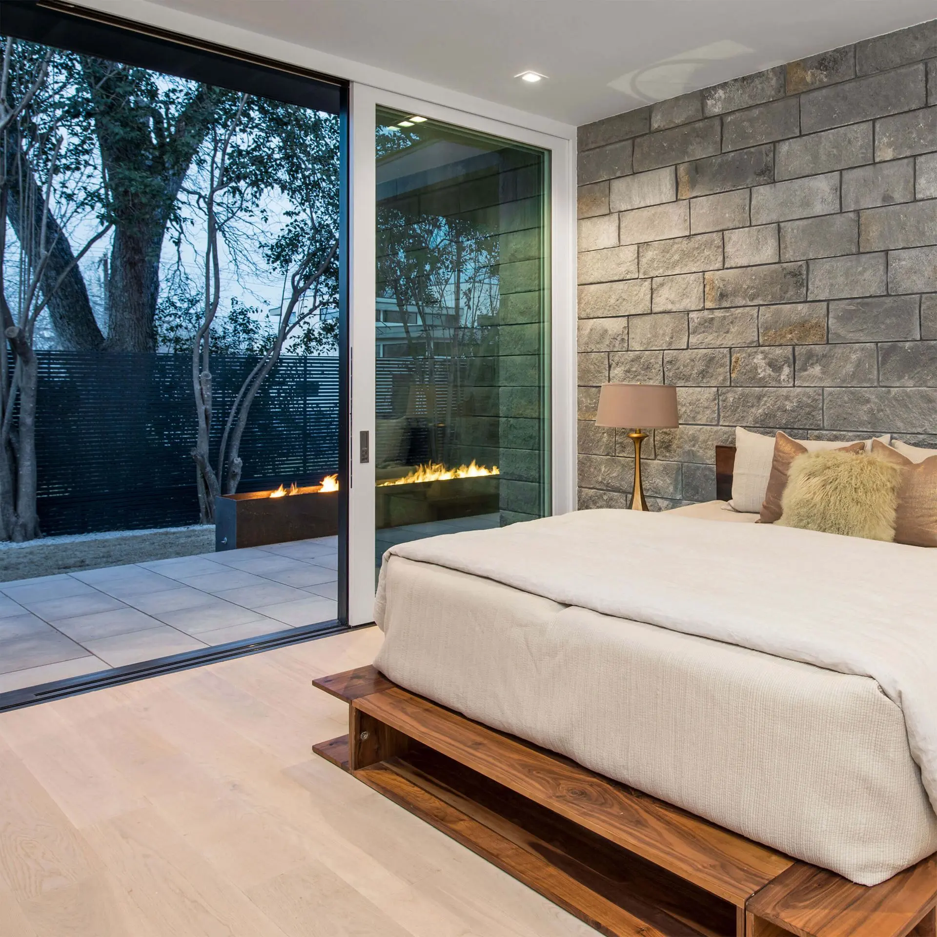 dcd7a9_a0ac7d6a15cb44408dffd44ef9ab2e0b_mv2_1gids4shmavvbmqnyp1vhi-1920x1920 Cozy modern bedroom with sliding glass door opening to a private patio